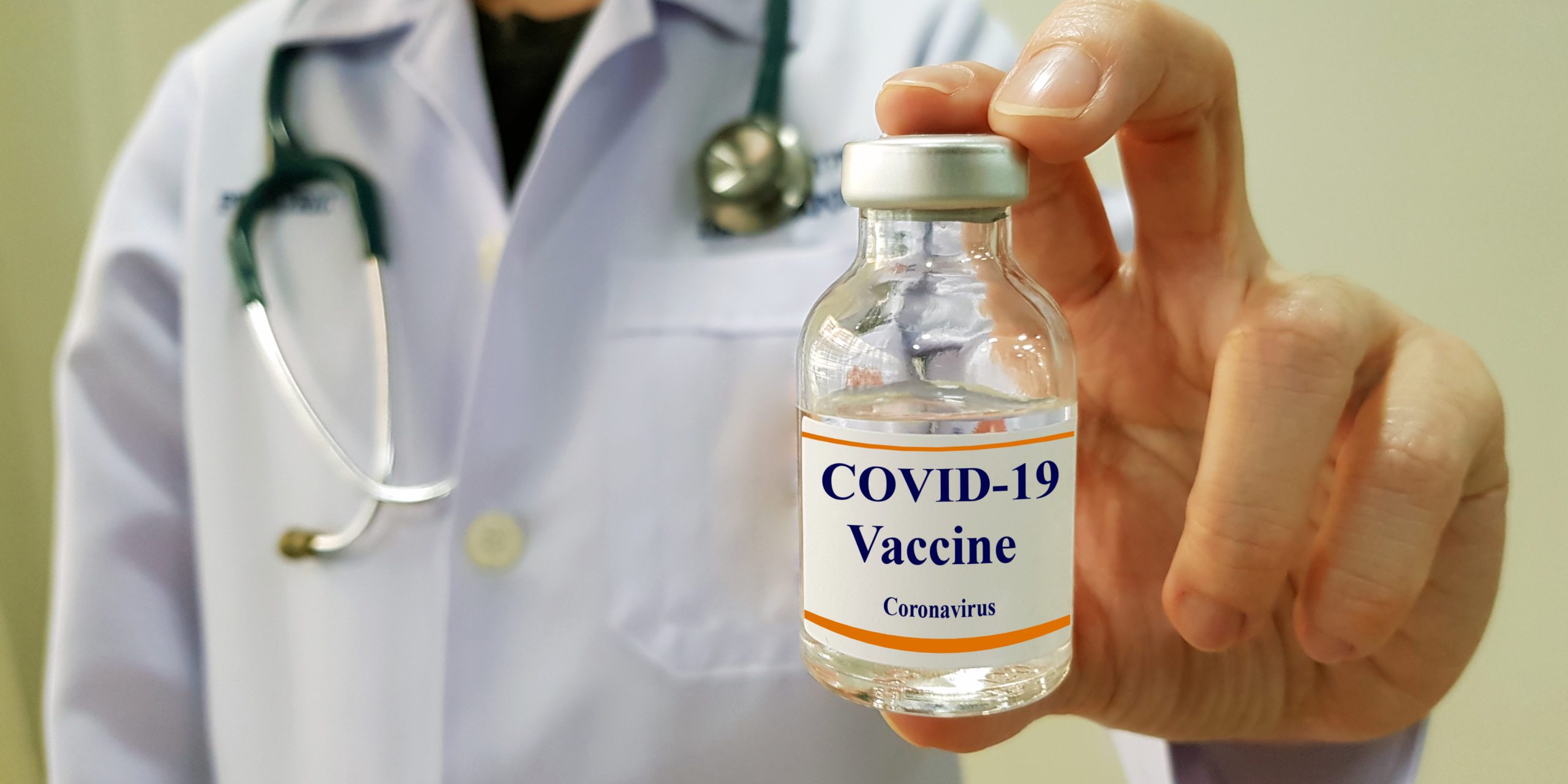 Infectious doctor show COVID 19 vaccine for prevention,immunization and treatment for new corona virus infection(COVID-19,novel coronavirus disease 2019 or nCoV 2019 from Wuhan). Medical technology.
