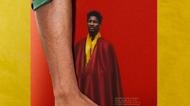 African Man Holding Record Concept Jon Batiste y FREEDOM