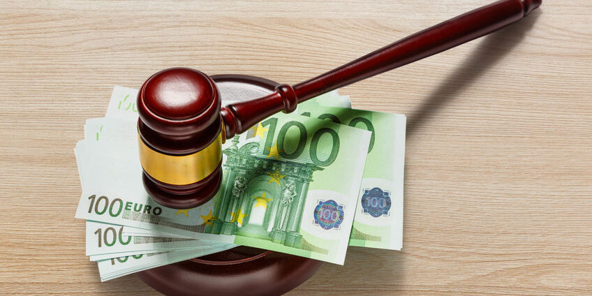 Judge’s gavel and one hundred euro banknotes